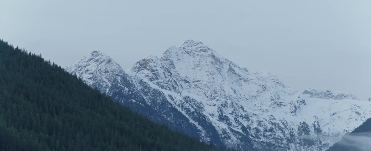 Snow capped mountain peaks