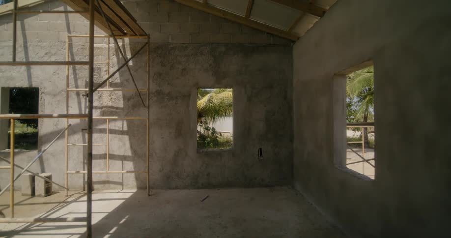 Interior view of new house under construction and garden