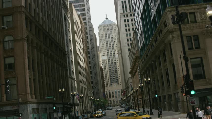 A tilting view moving through downtown chicago toward the chicago board of trade building