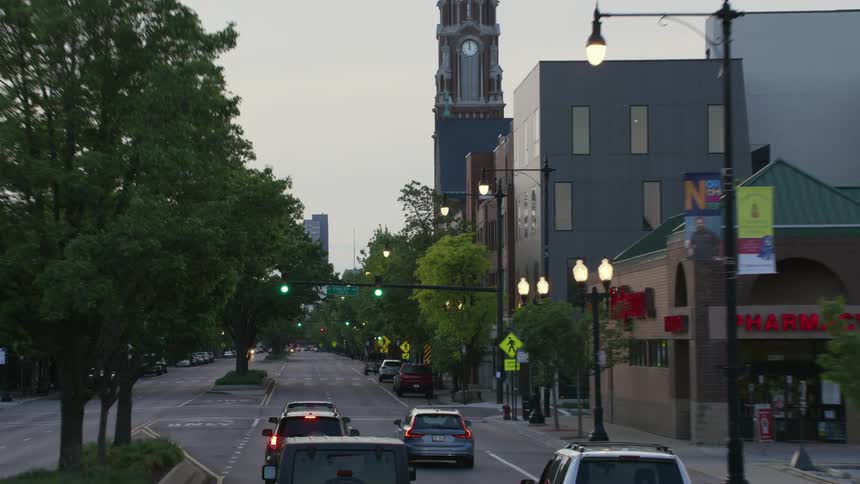 A view of cars driving outdoors at dusk