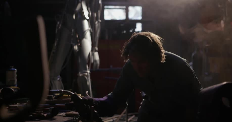 A person is welding in a shop