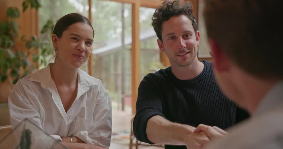 People sit together in a home talking