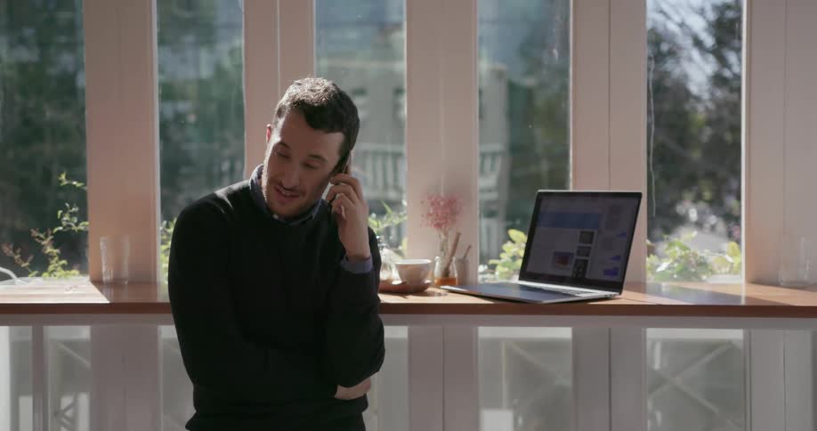 A man has a conversation on a cell phone