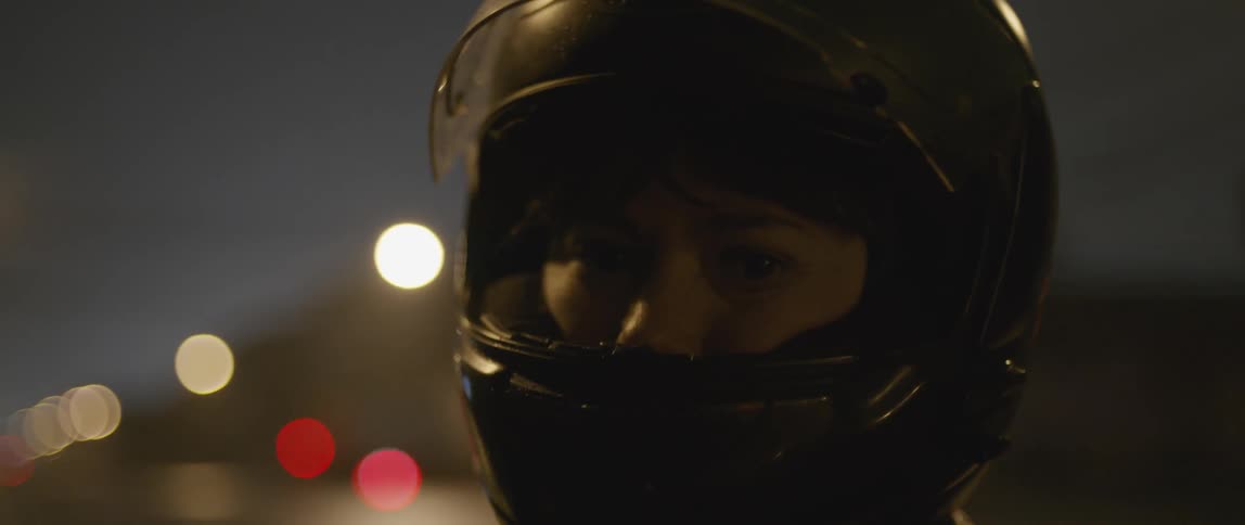 A person is wearing a motorcycle helmet