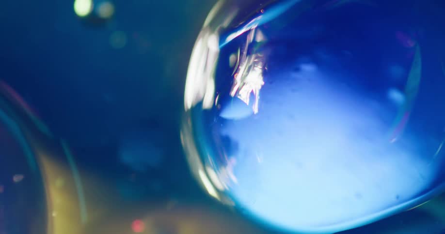 Abstract blue water balls move around in liquid