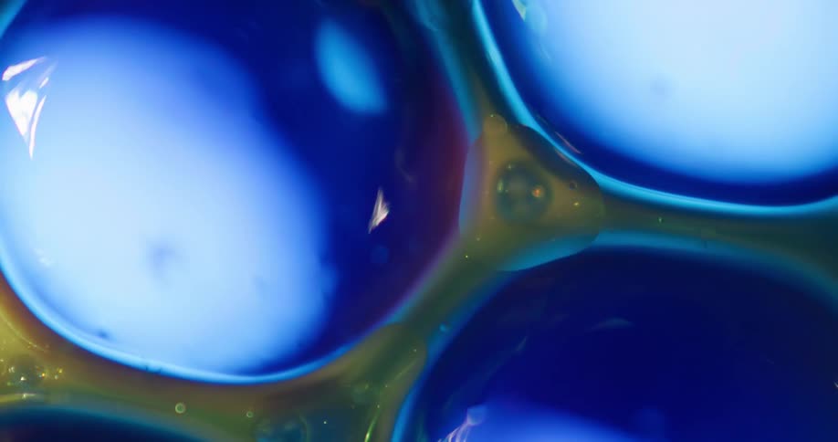 Light shines on blue bubbles brightening and lightening them