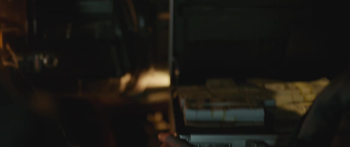 A briefcase is opened filled with cash