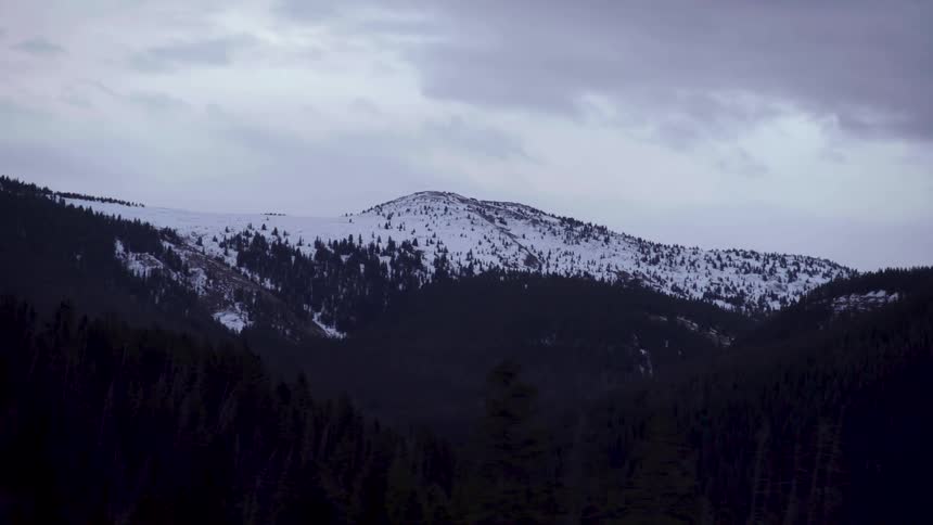 Snow is at the top of the mountain