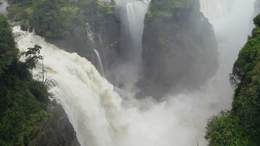 Aerial view of powerful white water jungle waterfall