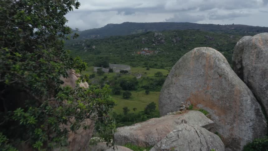 Aerial of a rocky ridge overlooking great stone ruins