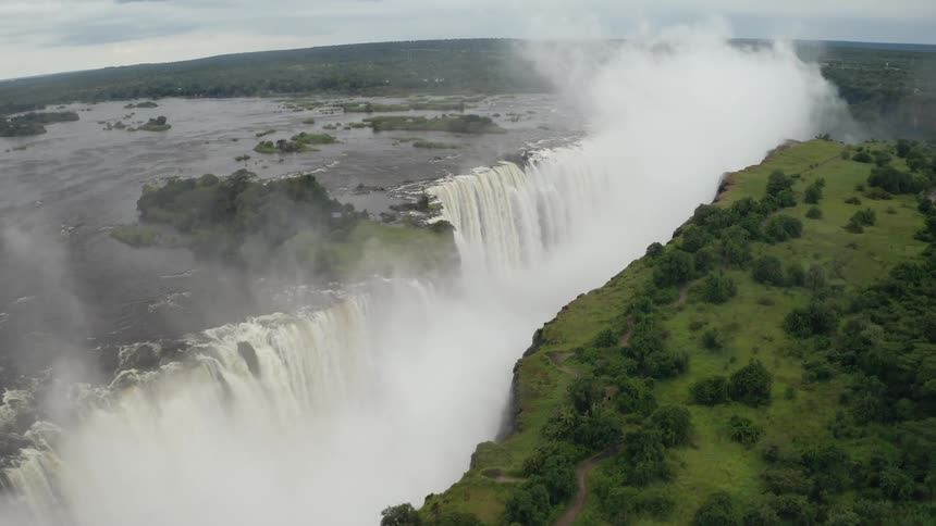 Aerial view of waterfall and lush greenery