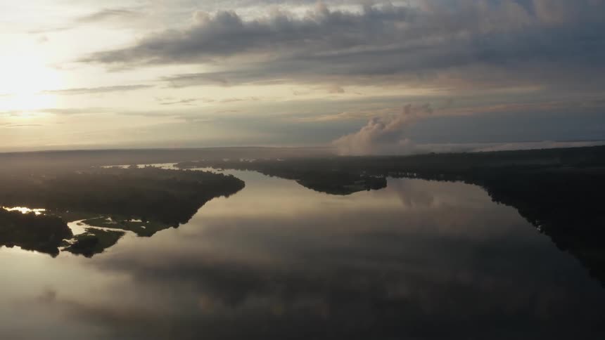 Aerial view of the sun setting in the horizon is displayed