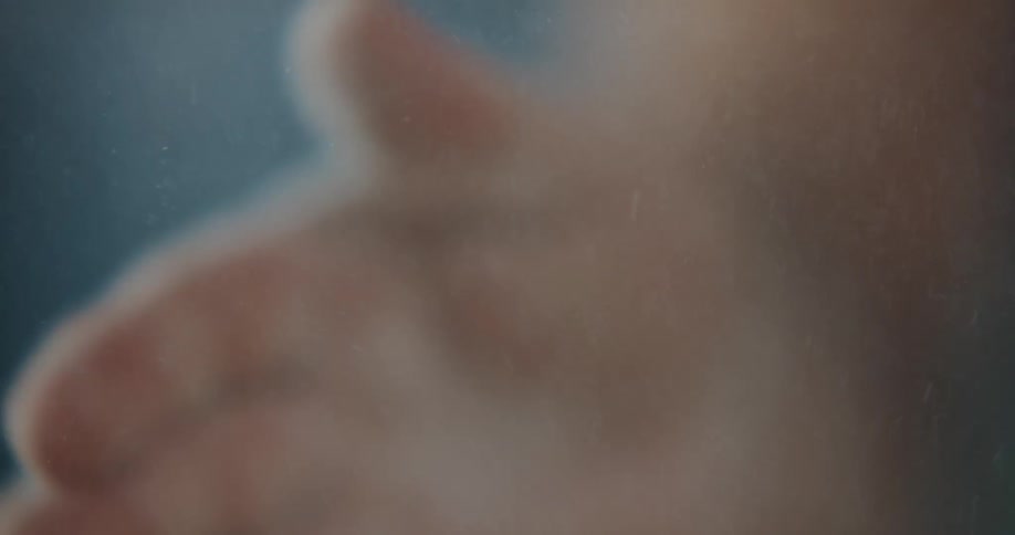 A person is removing powder from their hands