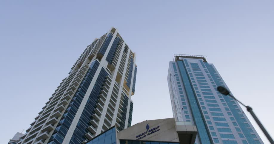 Tall buildings fill the sky