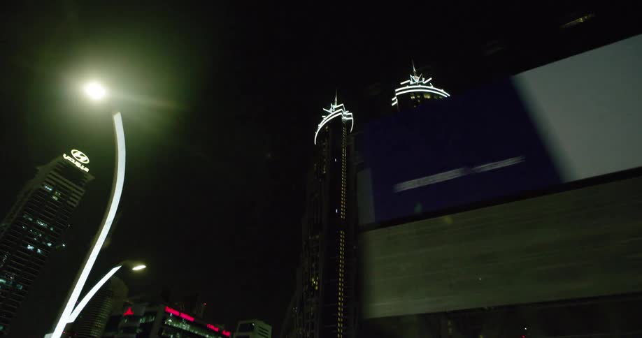 Skyscrapers are light up in a city in the dark night