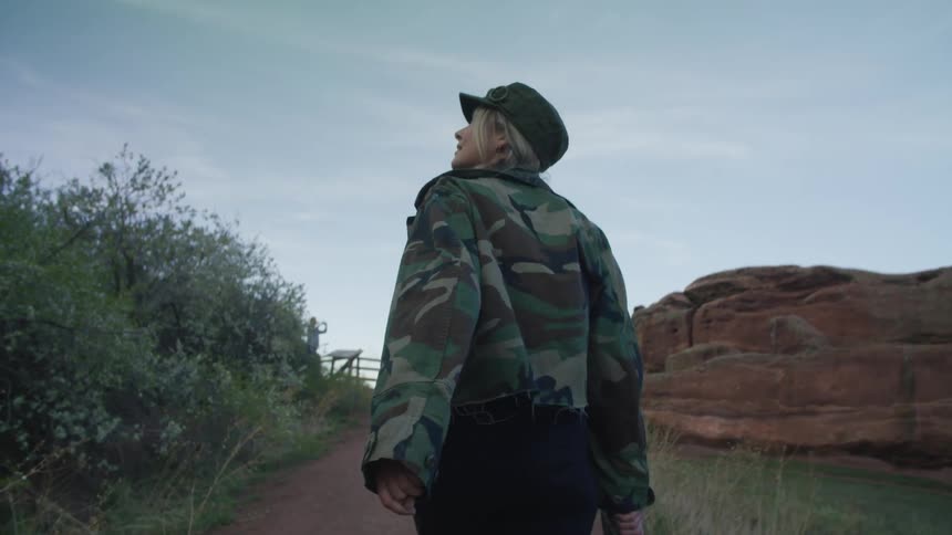 A woman is hiking on the trail