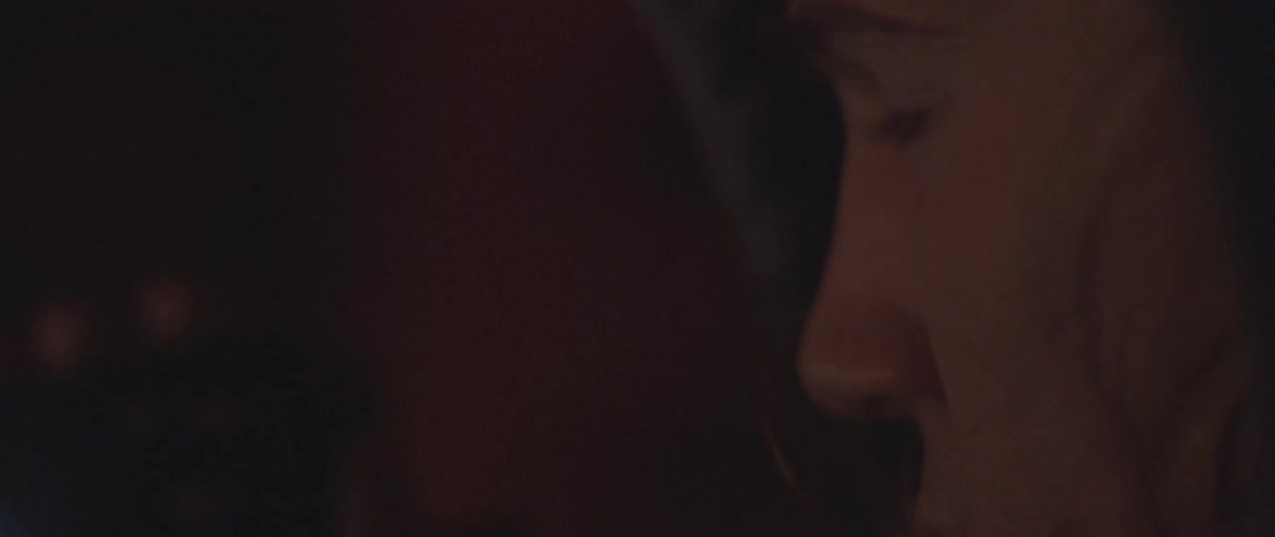 A man blinks as he looks forward