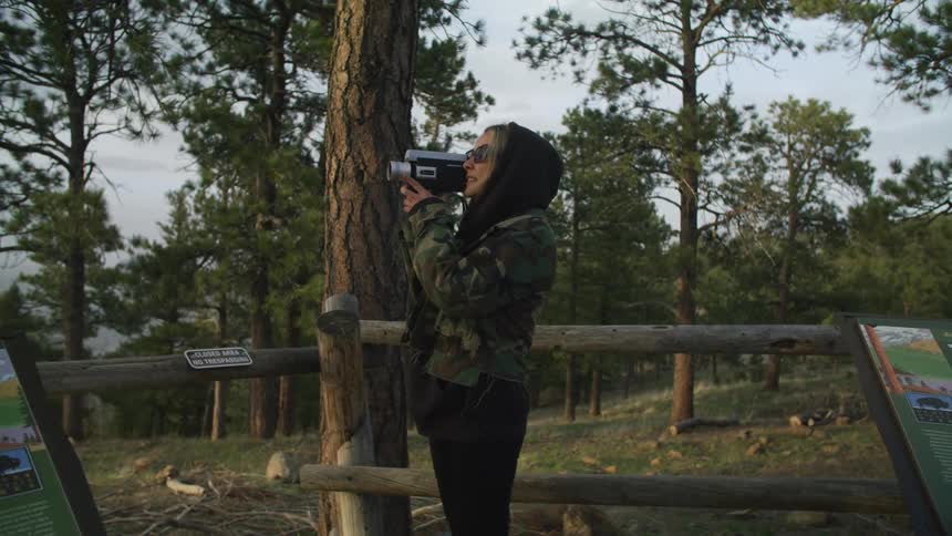 A woman is filming the park