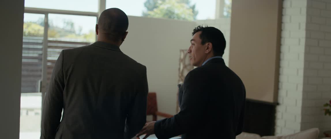 Realtor showing interested buyer a house for sale