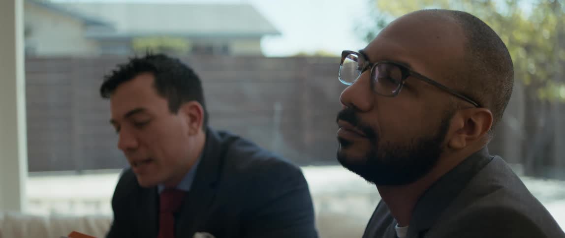A man is bored as someone is talking to him