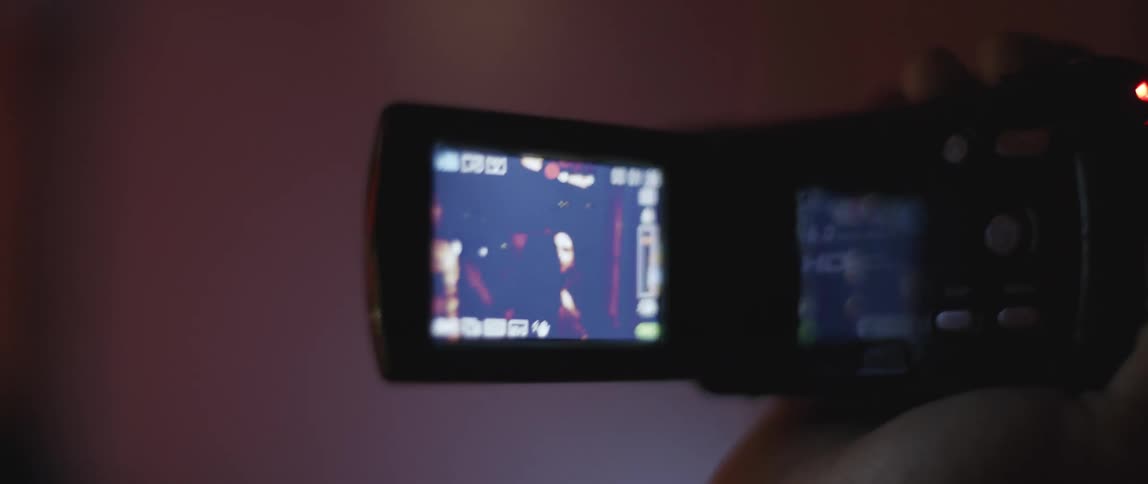 A person is filming other people