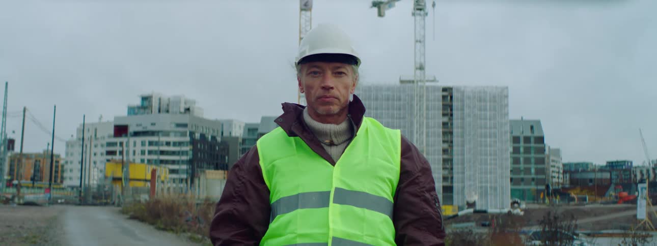 A construction worker is standing on site