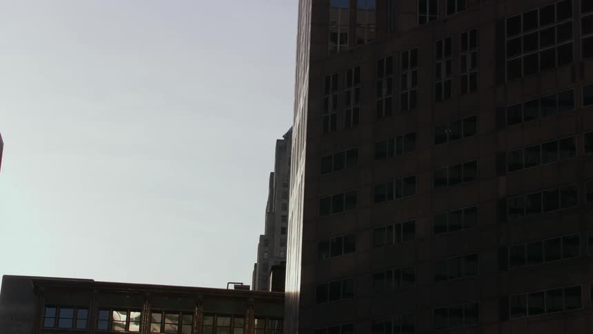 A rotating reveal of buildings in a city