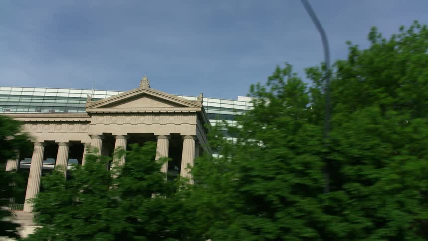 A large building in a metropolis during the day