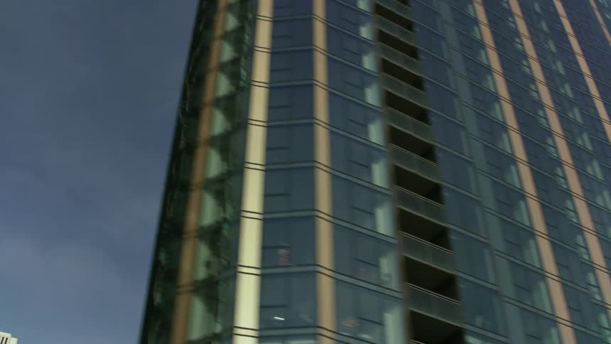 A panning shot of skyscrapers while moving through downtown chicago