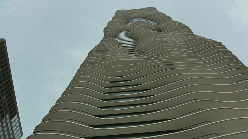 The aqua tower in chicago with its flowing balconies and pools of windows