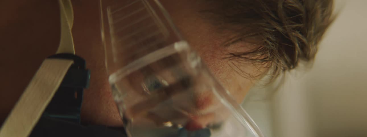 Man wearing protective goggles and air filtration mask working on a laboratory