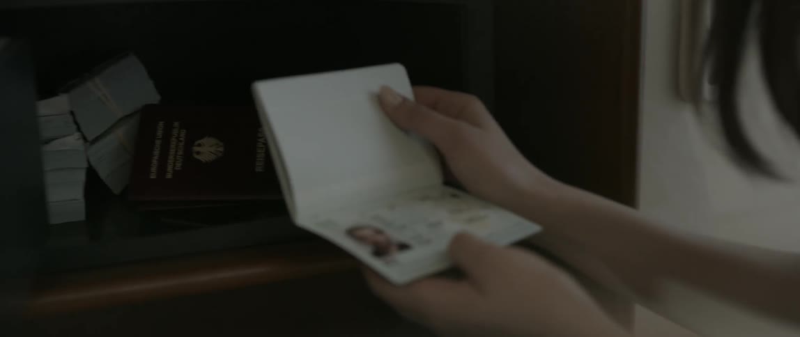 A woman opens a safe
