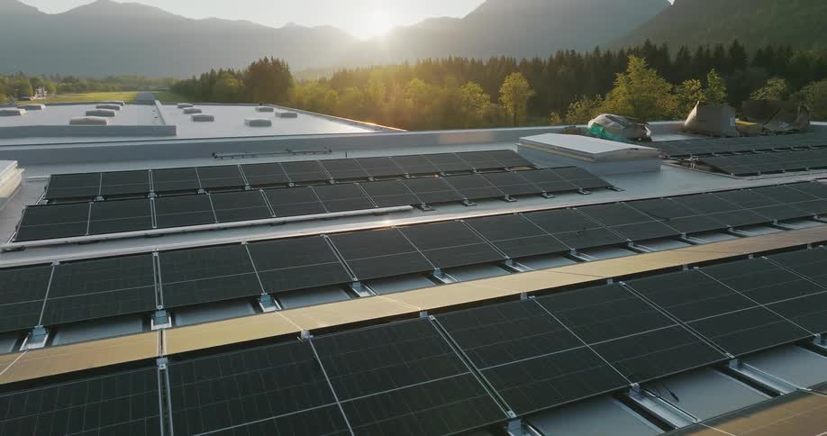 Solar panels cover the rooftop of a large building