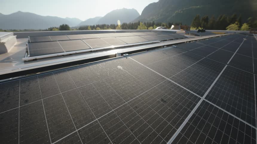 Drone shot of solar panels on a building roof