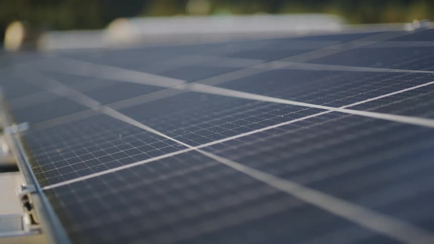 A solar panel sits at an angle outdoors