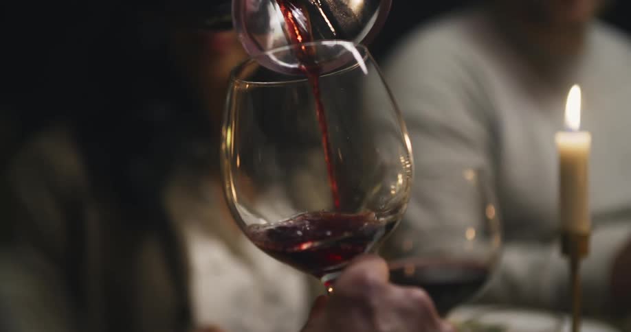Wine is poured into a wine glass