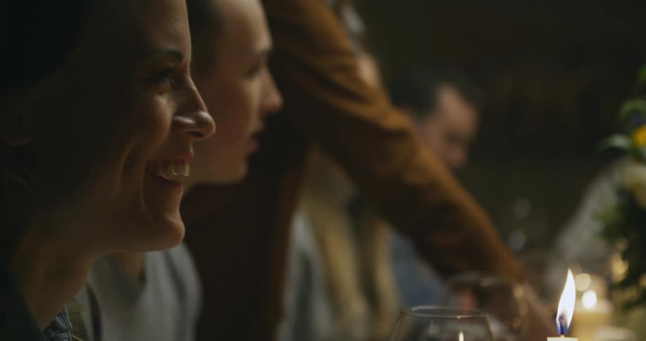 A family sits at the table for a holiday dinner