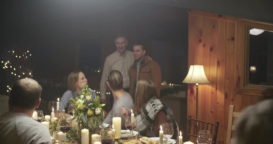 Family gathered in a dining room to celebrate the holidays