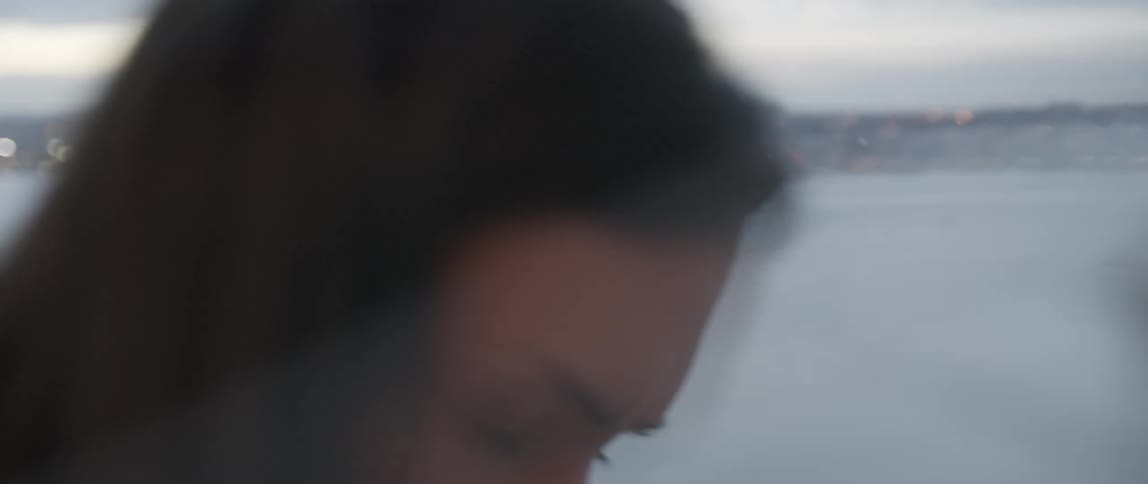 A woman looks at an x-ray on a window
