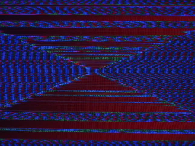 Red and blue static lines make a pattern as they move and vibrate on the screen