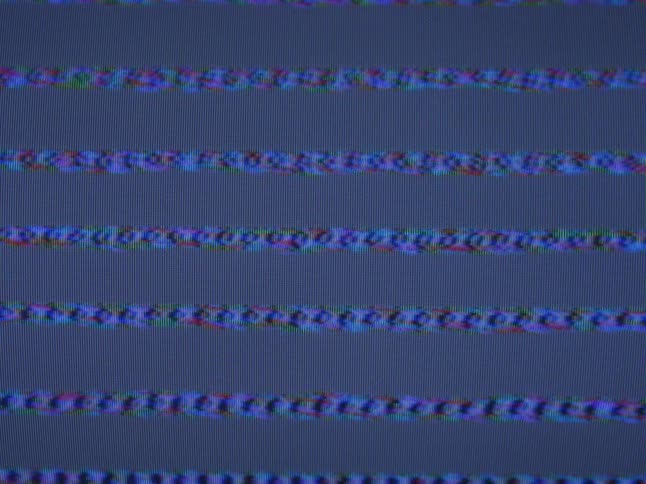 Lines of blue static play on a television screen
