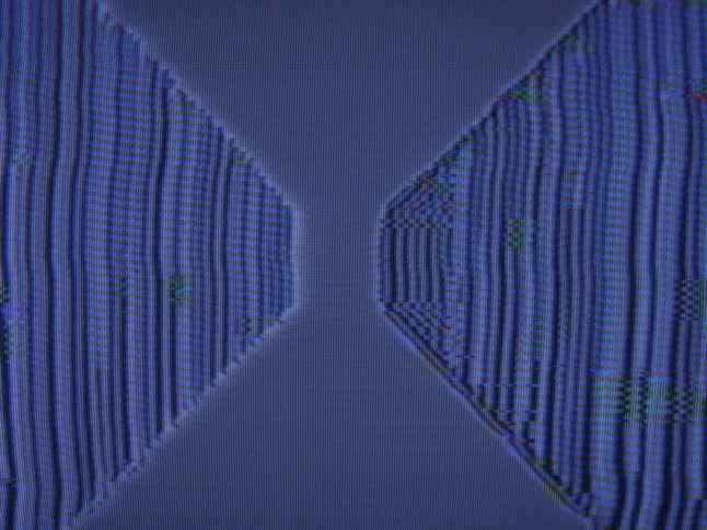 Vertical lines of blue static play on a television screen