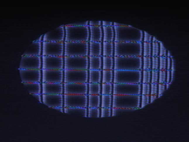 Digital image with varying patterns show in oval against dark background