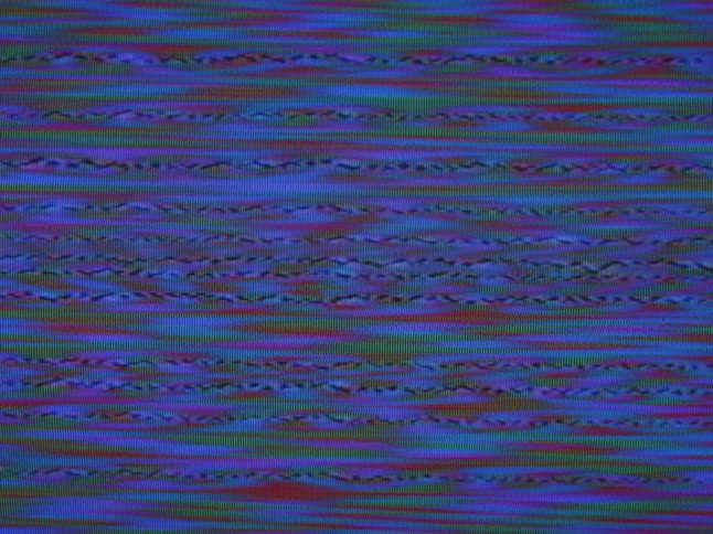 Squiggly red and green lines play against a blue background on a screen