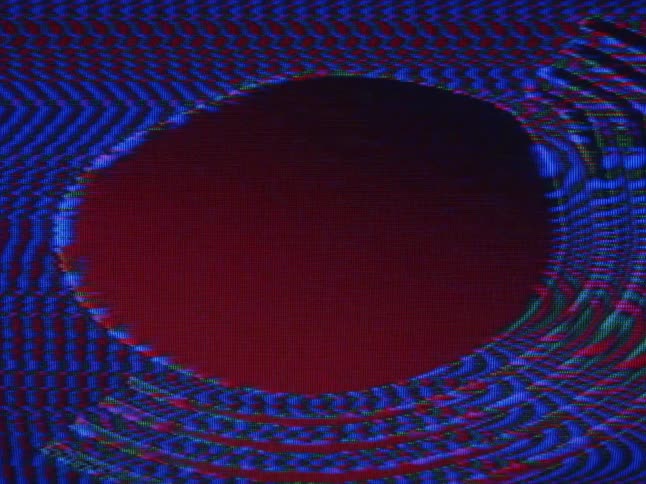 Blue waves make lines and chevrons then turn allow a circle to form in the middle