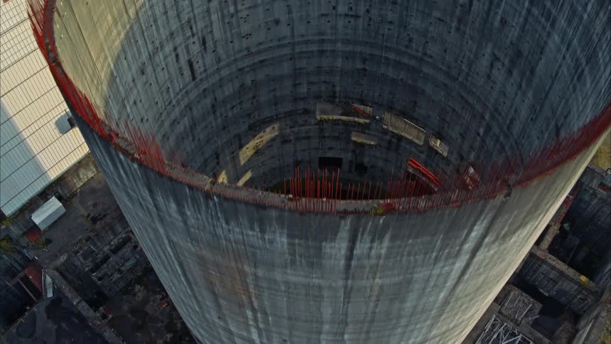 Aerial drone shot flying over a shut down nuclear reactor core
