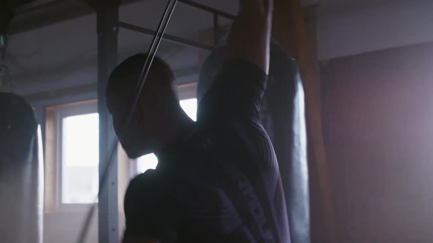 A man is stretching in the gym