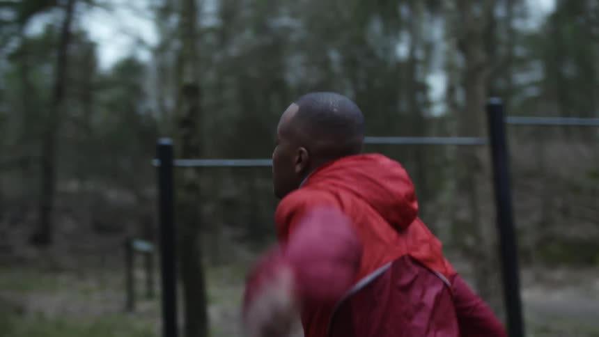 A man is exercising outdoors in the woods