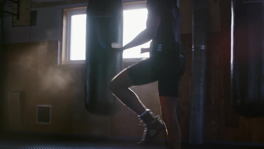 A man jumps rope indoors as he exercises