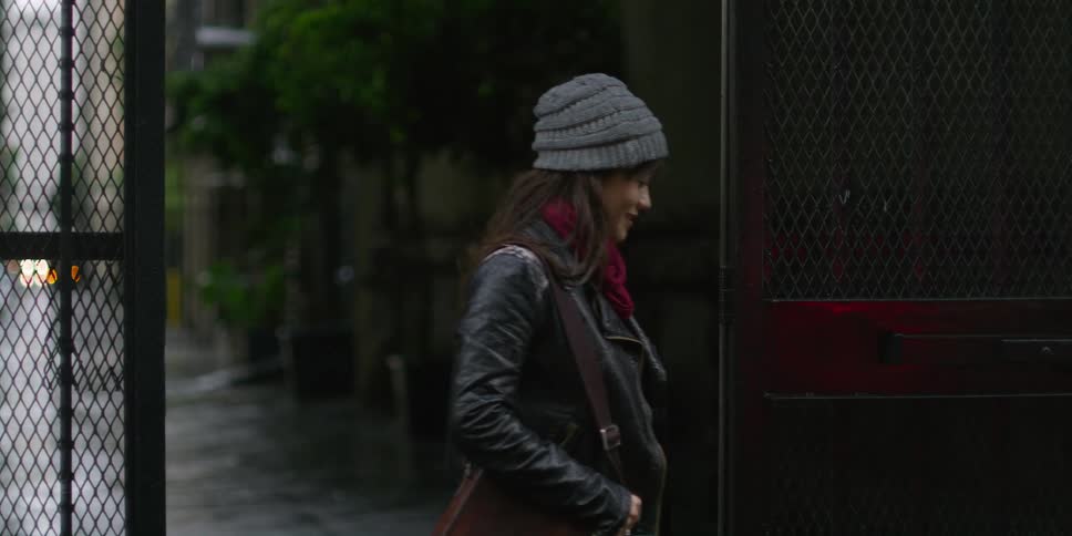 A woman walks out of the gate